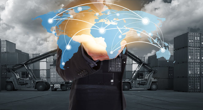 Global network coverage world map on hand of businessman, Industrial Container Cargo yard for Logistics Import Export. (Elements of this image furnished by NASA)