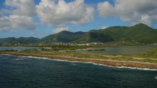 St Maartin Aerial v49 Flying low along penisula near Orient and Le Galion Beaches panning.