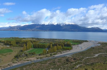Small river flowing past a farm on the shore of General Carrera Lake, Patagonia.