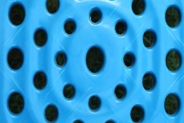 The old and dirty short plastic chair blue color represent the garden furniture concept related idea.