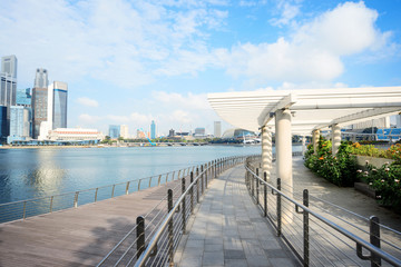 cityscape and skyline of modern city from wood footpath