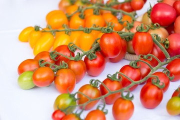 cluster of cherry tomatoes on the white background