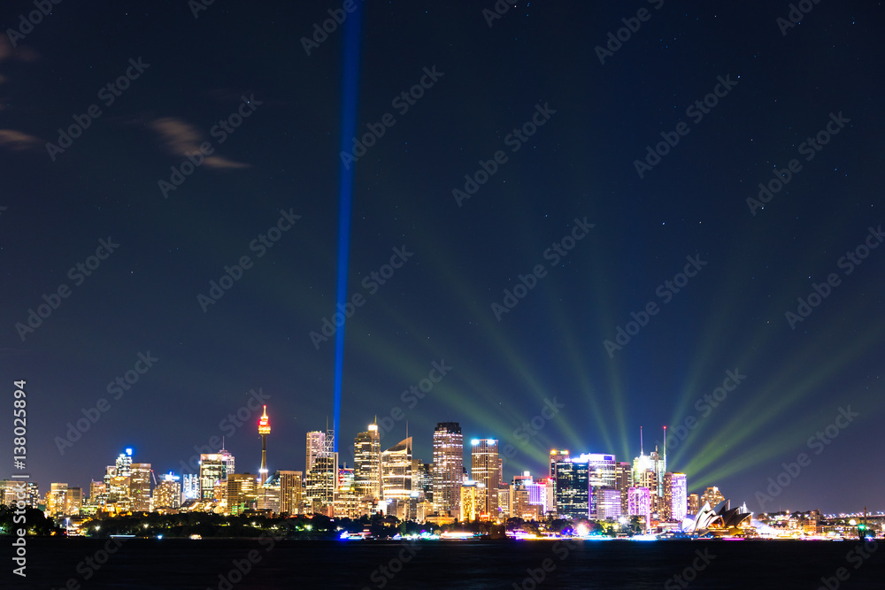 Wall mural Sydney cityscape at night with colorful lights illuminating skyline