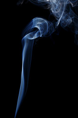 Obraz premium Abstract art. Color white blue smoke from the aromatic sticks on a black background. Background for Halloween. Texture fog. Design element. The concept of aromatherapy.