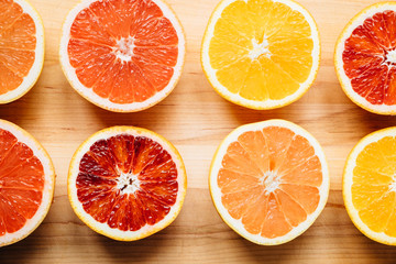 Citrus fruit arranged on a wooden table and photographed from above