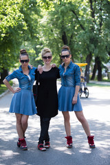 Obraz premium portrait of three young beautiful woman with sunglasses