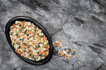 Lentils Quinoa and Dired Beans in Bowl over Slate Top View