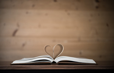 Pages of a book forming the shape of the heart. Love concept.