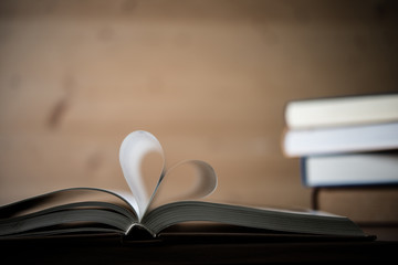 Pages of a book forming the shape of the heart. Love concept.