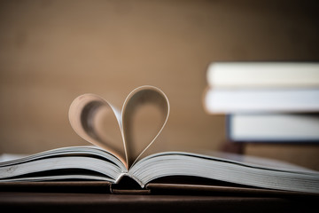 Pages of a book forming the shape of the heart. Love concept.