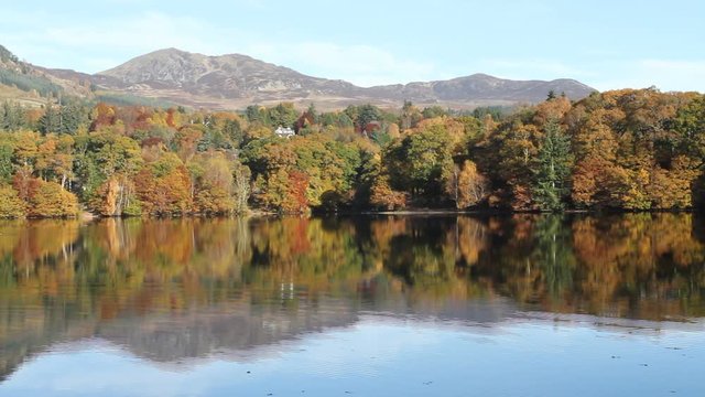 Autumn colours reflected in Loch Faskally Pilochry Scotland
