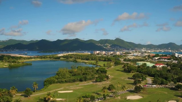 St Maartin Aerial v59 Flying low over golf course in Maho area panning.