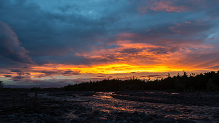 Fototapeta na wymiar Beautiful sunset on river Studenaya. Kamchatka Peninsula.