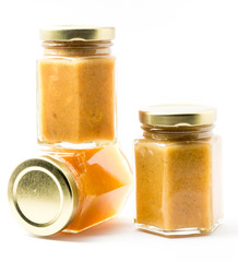 Jars of generic baby food on white background