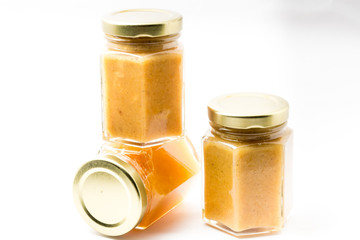 Jars of generic baby food on white background