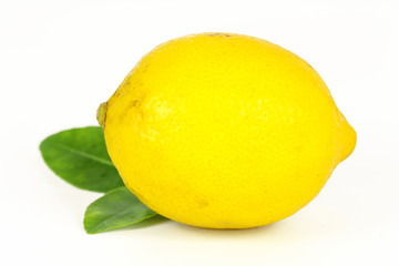 fresh lemon whole and slice with lemon leaf