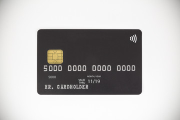 Black bank credit card on white background