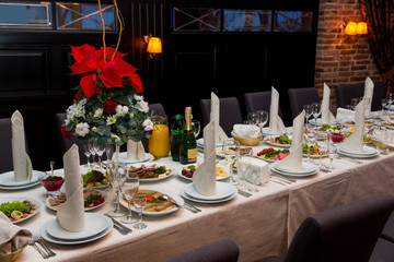 Red flower is on the banquet table. Corporate banquet