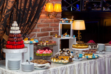 Sweet table for a wedding. Colorful table with sweets for the wedding