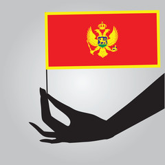 Hand with flag Montenegro