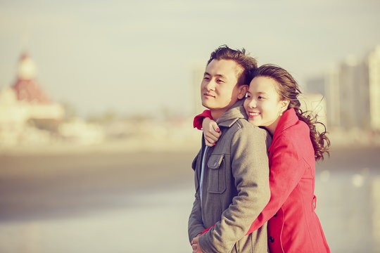 Happy young couple enjoy being at the beach