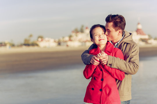 Happy young couple enjoy being at the beach