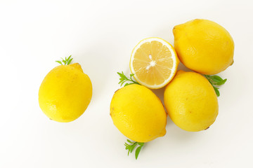 fresh lemon whole and slice with lemon leaf