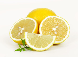 fresh lemon whole and slice with lemon leaf