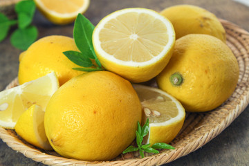 fresh lemon whole and slice with lemon leaf