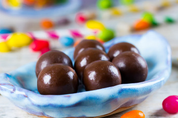 Chocolate candies in a blue plate