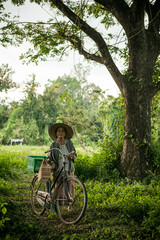 Grandmother on bikes at the country side