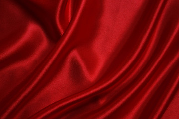 Naklejka na ściany i meble Red cloth waves background texture.