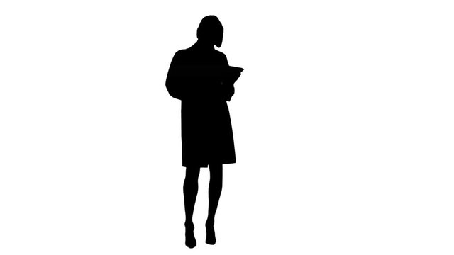 Silhouette Pretty female doctor with stethoscope using digital tablet 