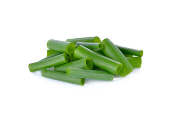 pile of portion cut spring onion on white background