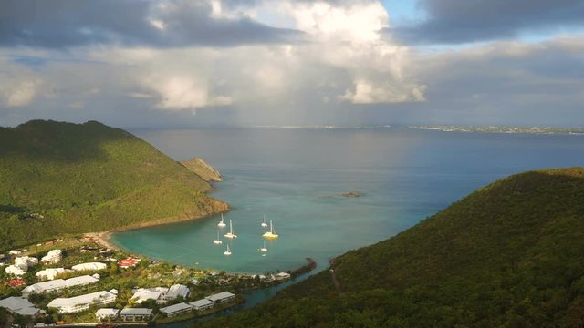 St Maartin Aerial v73 Flying low over Anse Marcel area panning at sunrise.