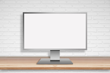 Computer Mornitor with blank screen on wood table with white wall