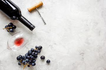 restaurant set with wine bottle and grape on stone top view mock-up