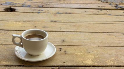 Coffee cup on wooden table