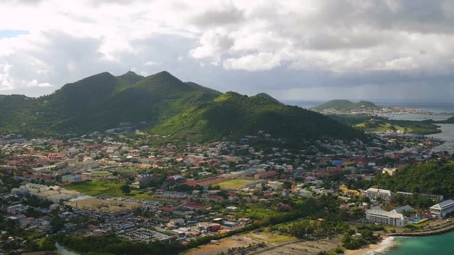 St Maartin Aerial v78 Flying low over Marigot town area panning.