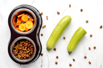 organic pets food with zucchini and carrot on table background top view mockup
