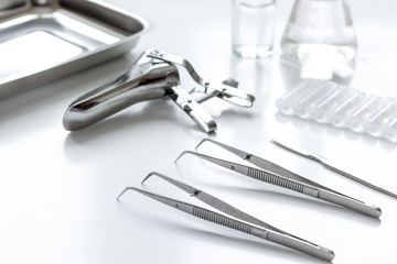 instruments of gynecologist on white background