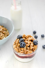 Healthy morning with granola breakfast on white kitchen table