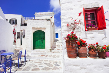 Fototapeta premium Traditional greek street with flowers in Amorgos island, Greece