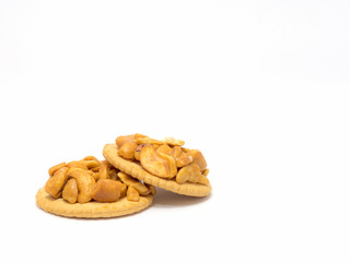 Cracker with cashew nut isolated on background