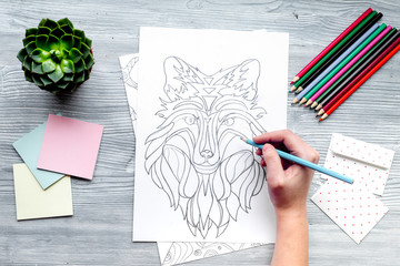 coloring picture for adults on wooden background top view