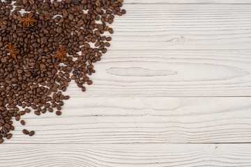 Coffee beans with star anise on old white table. Top view.