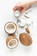 organic cosmetics with coconut on white background top view