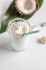 cocktail with coconut on white background