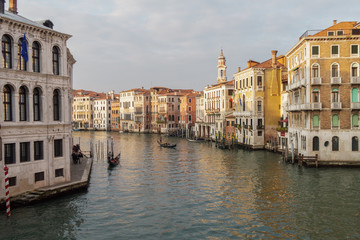 Fototapeta na wymiar Venice, Italy evening view of Grand Canal with gondolas. Day view of the Grand Canal of Venice seen from top of Rialto Bridge - Ponte di Rialto. 