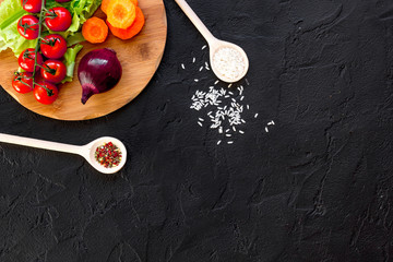 ingredients for paella on dark background top view